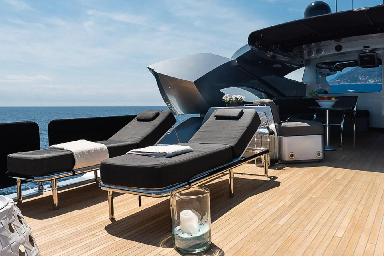 a pool table and chairs on a deck aboard SMOOTH OPERATOR Yacht for Sale