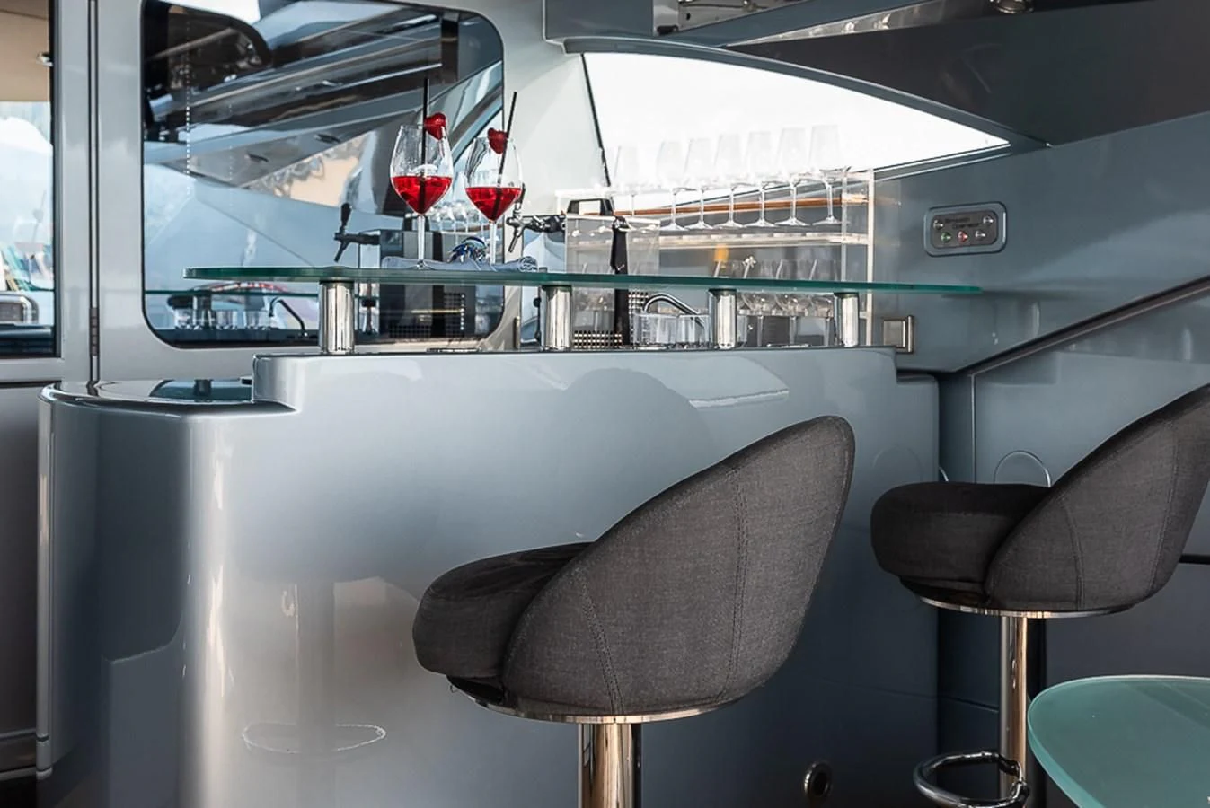 a room with a chair and a table with chairs aboard SMOOTH OPERATOR Yacht for Sale
