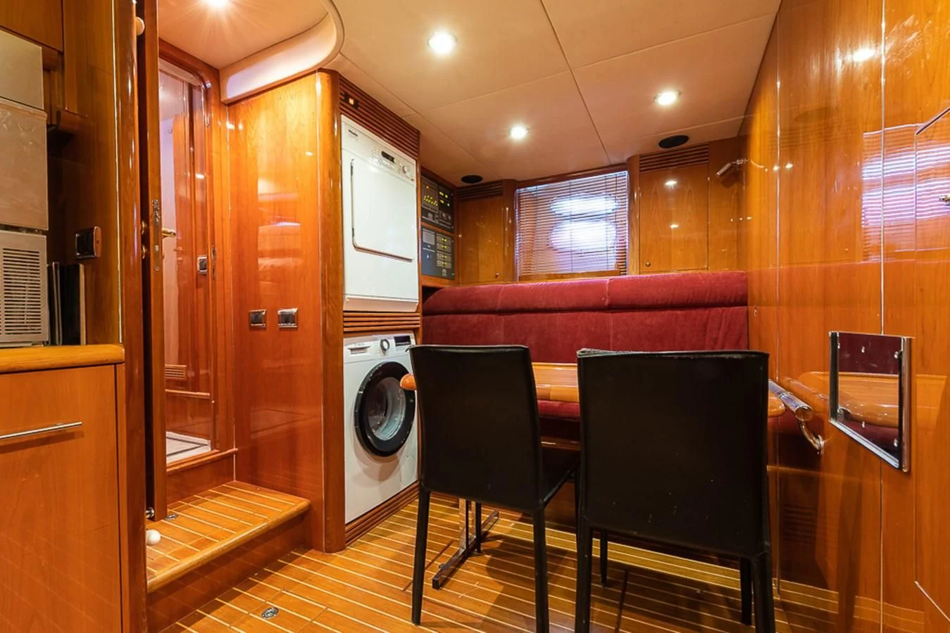 a room with a washing machine and a chair aboard SMOOTH OPERATOR Yacht for Sale