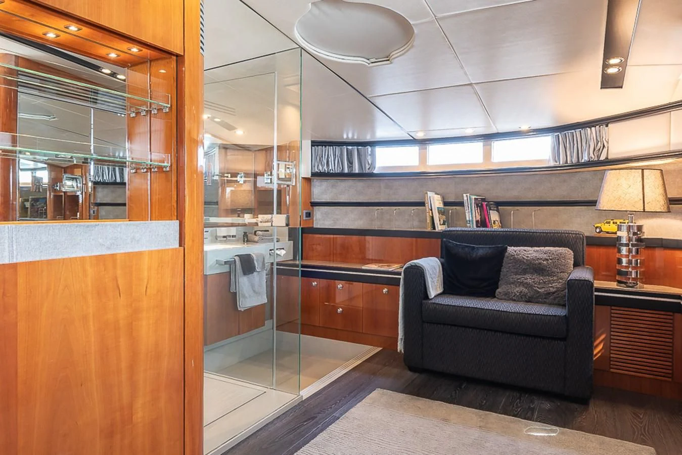 a room with a couch and a mirror aboard SMOOTH OPERATOR Yacht for Sale
