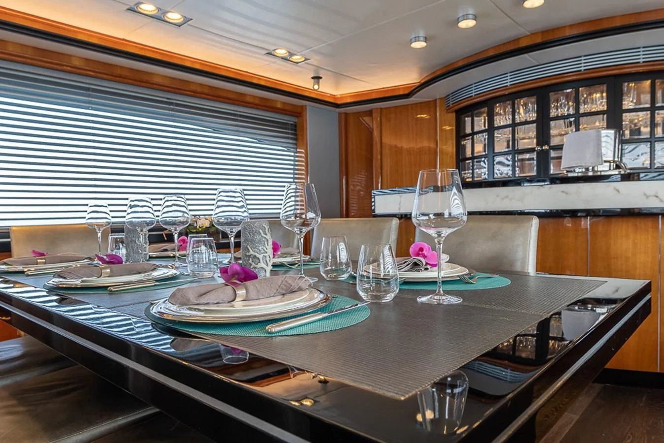 a large table with wine glasses aboard SMOOTH OPERATOR Yacht for Sale