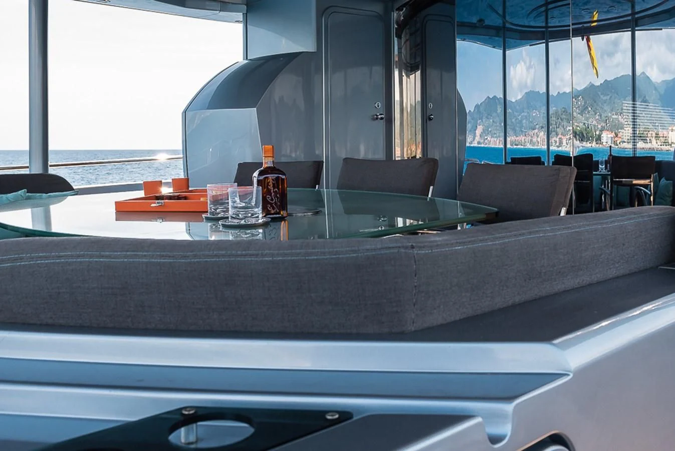 a table with a bottle of liquor on it aboard SMOOTH OPERATOR Yacht for Sale