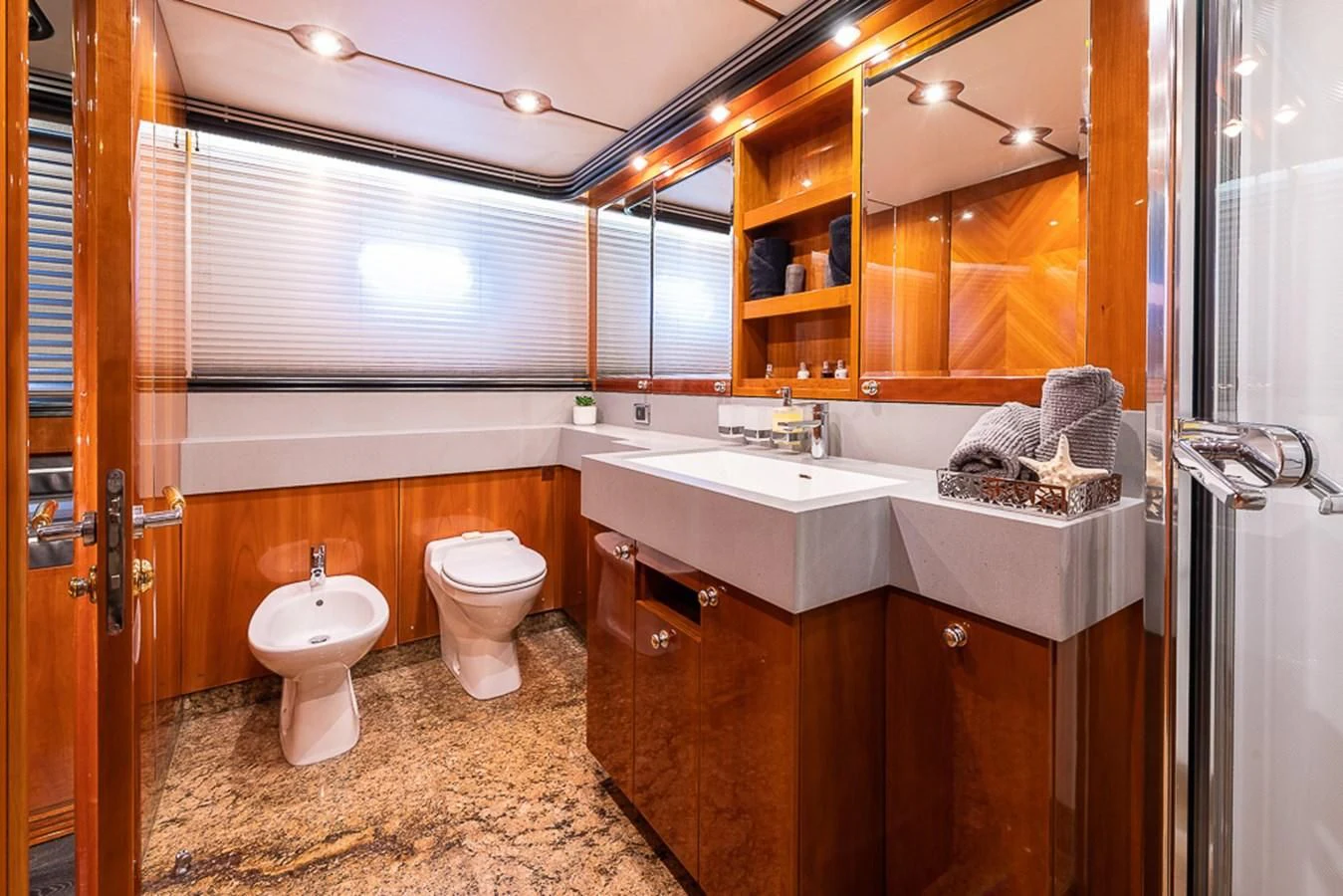 a bathroom with a sink and toilet aboard SMOOTH OPERATOR Yacht for Sale