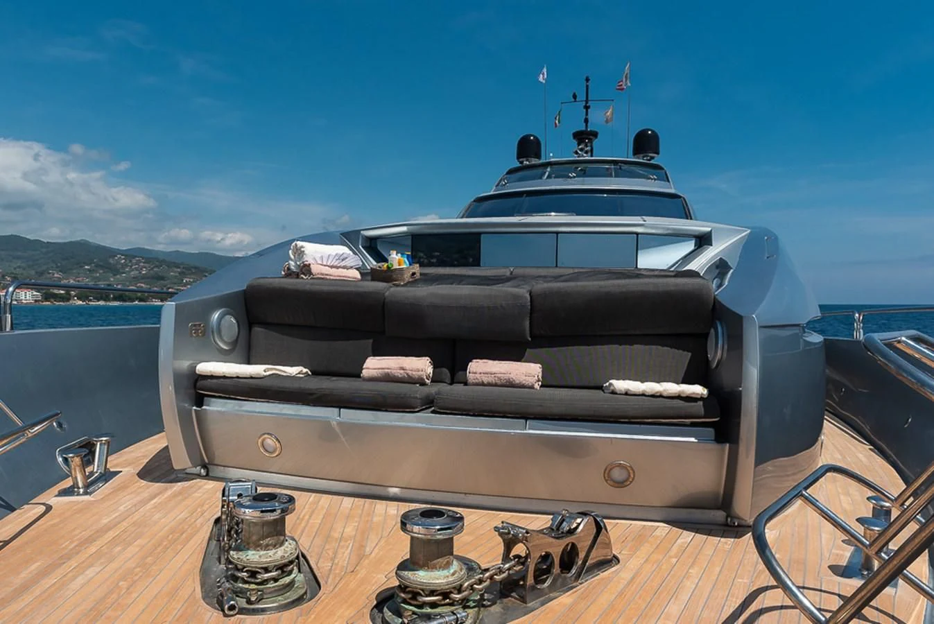 a black car with a large spoiler on a wooden surface aboard SMOOTH OPERATOR Yacht for Sale