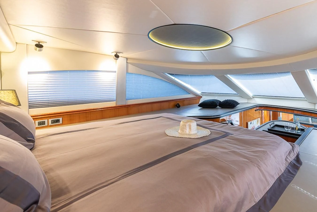 a room with a bed and a desk aboard SMOOTH OPERATOR Yacht for Sale