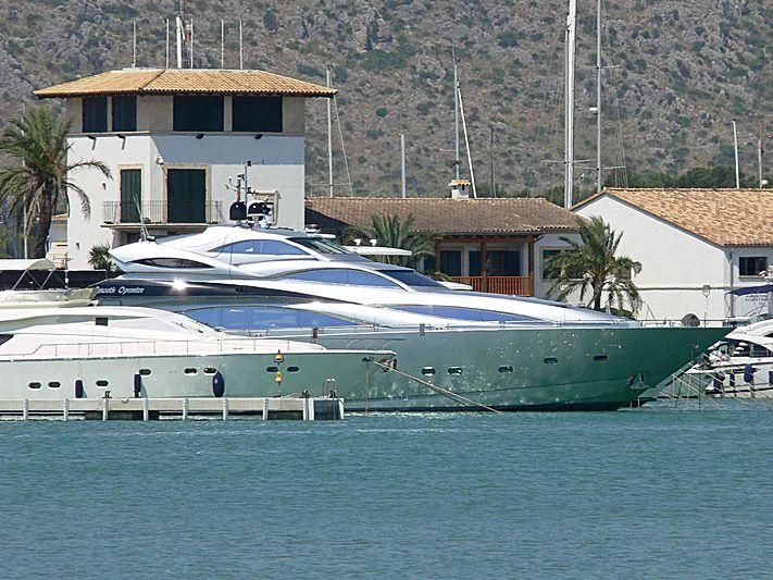 a large white boat in a harbor aboard SMOOTH OPERATOR Yacht for Sale