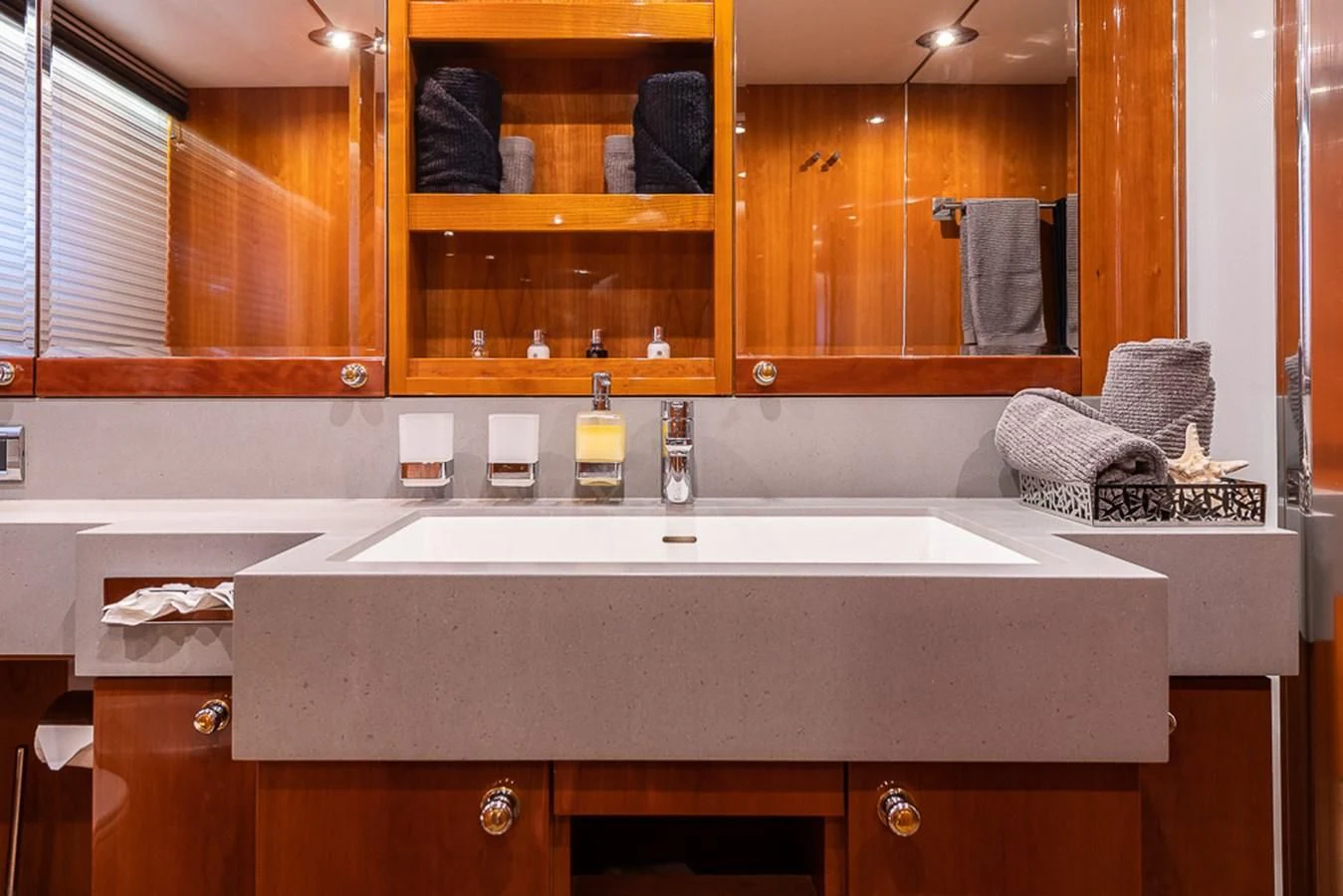 a bathroom with a countertop sink and cabinets aboard SMOOTH OPERATOR Yacht for Sale