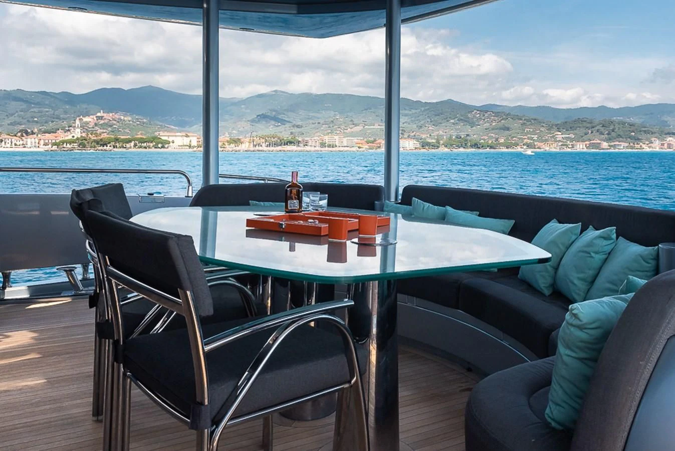 a table with a bottle of wine on it aboard SMOOTH OPERATOR Yacht for Sale