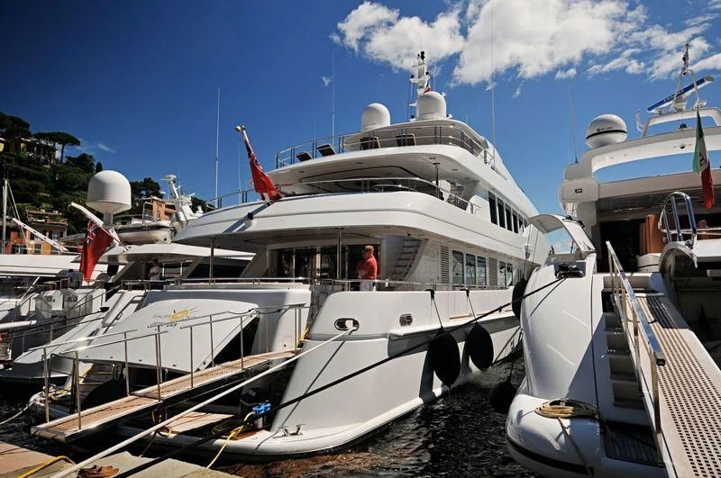 a boat docked at a pier aboard COCO Yacht for Sale