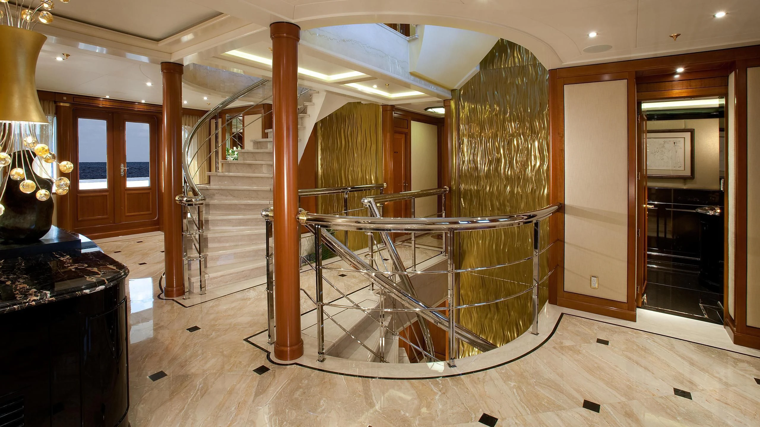 a room with a staircase and wood floors aboard ATTESSA IV Yacht for Sale