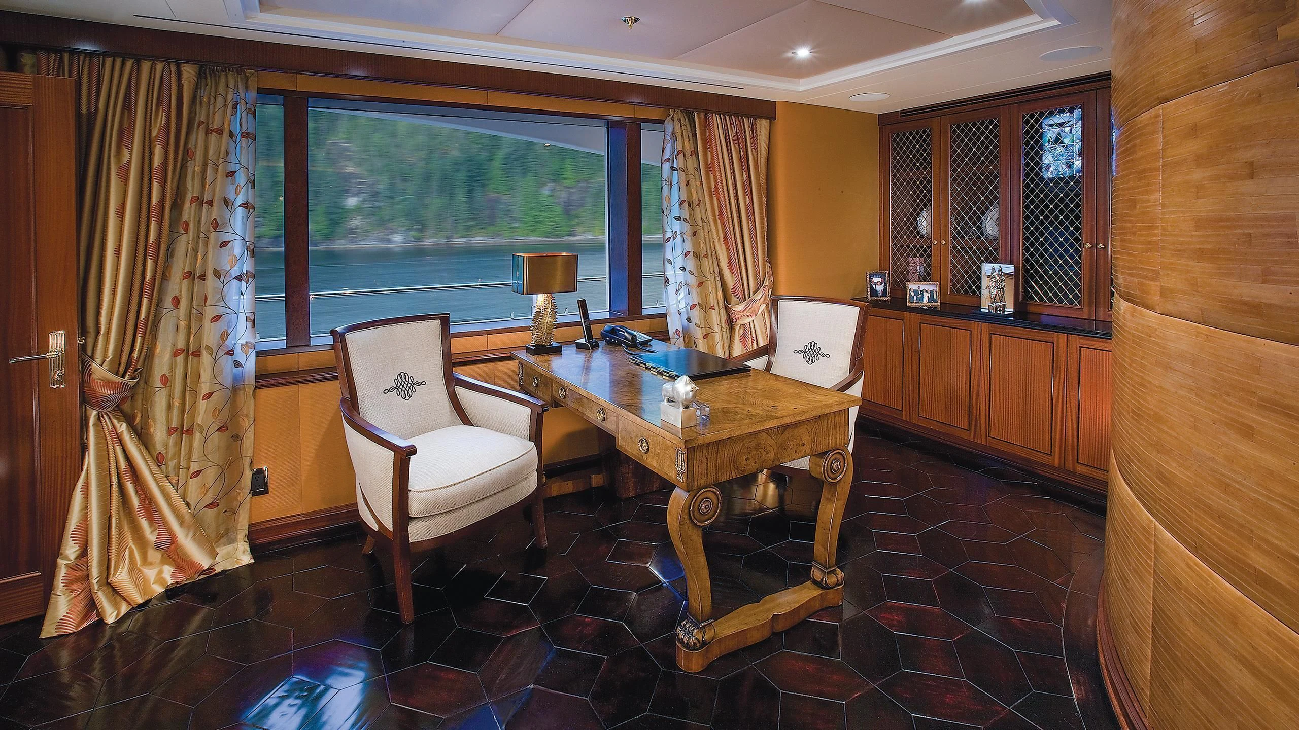 a room with a table and chairs aboard ATTESSA IV Yacht for Sale