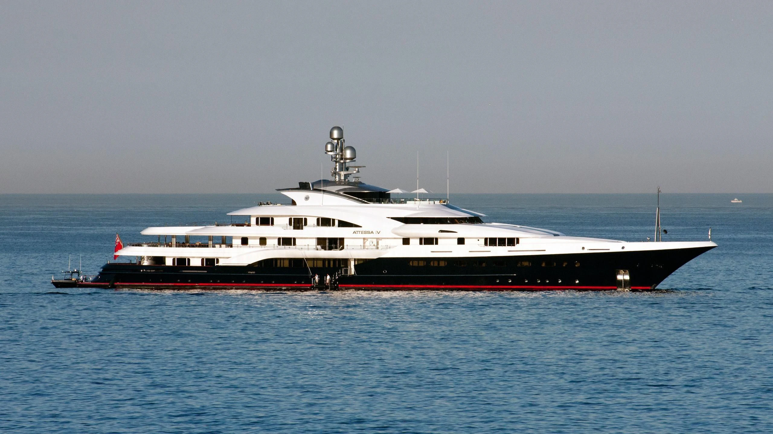 a large white boat on the water aboard ATTESSA IV Yacht for Sale