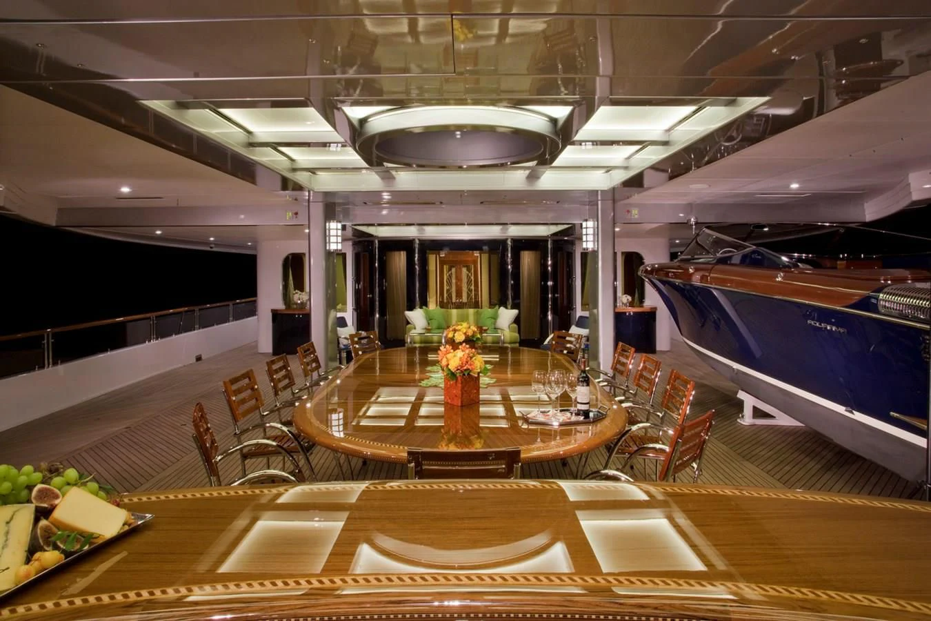a large room with tables and chairs aboard ATTESSA IV Yacht for Sale