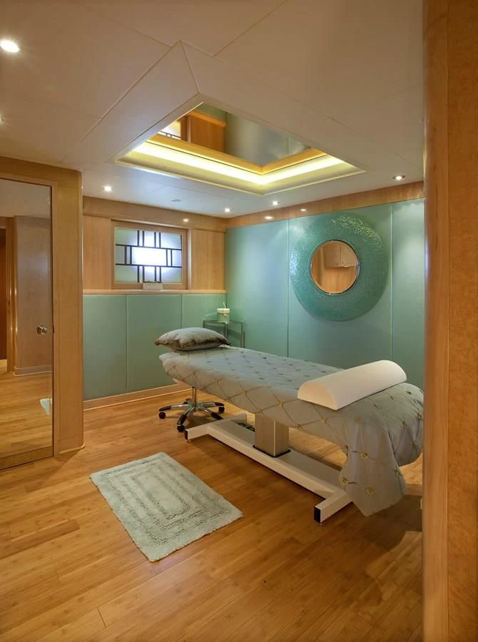 a room with a bed and a window aboard ATTESSA IV Yacht for Sale