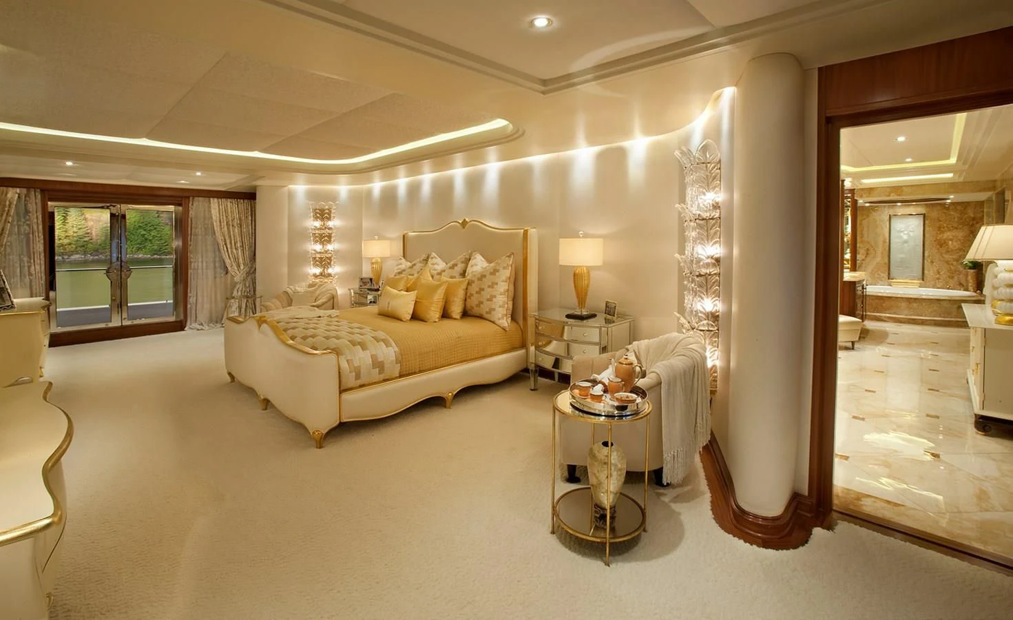 a large bedroom with a large bed aboard ATTESSA IV Yacht for Sale