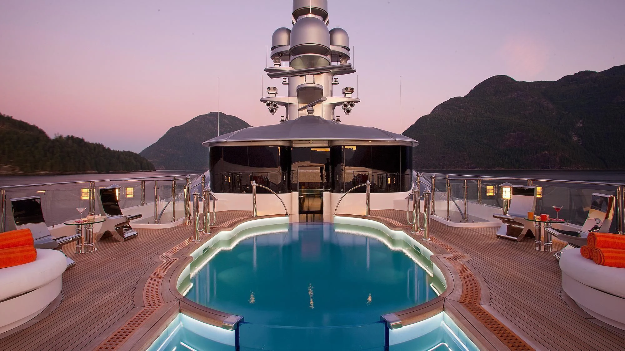 a pool next to a building aboard ATTESSA IV Yacht for Sale