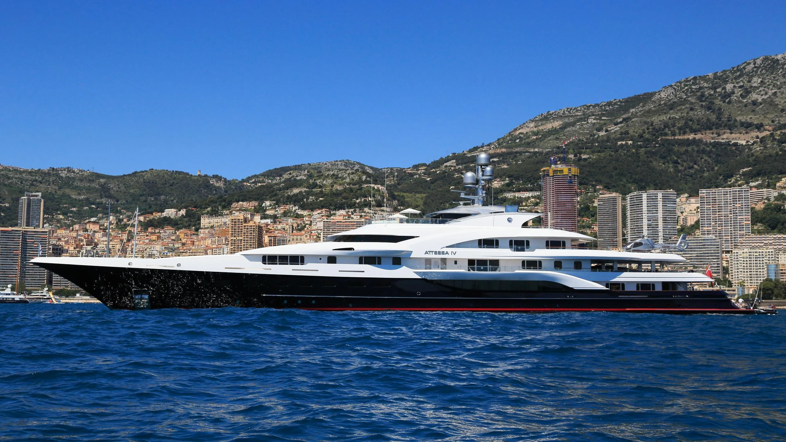 a large white boat on the water aboard ATTESSA IV Yacht for Sale