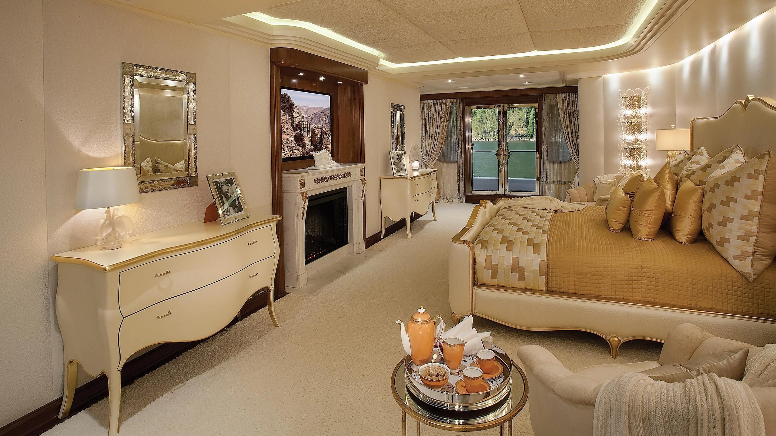 a living room with a fireplace aboard ATTESSA IV Yacht for Sale