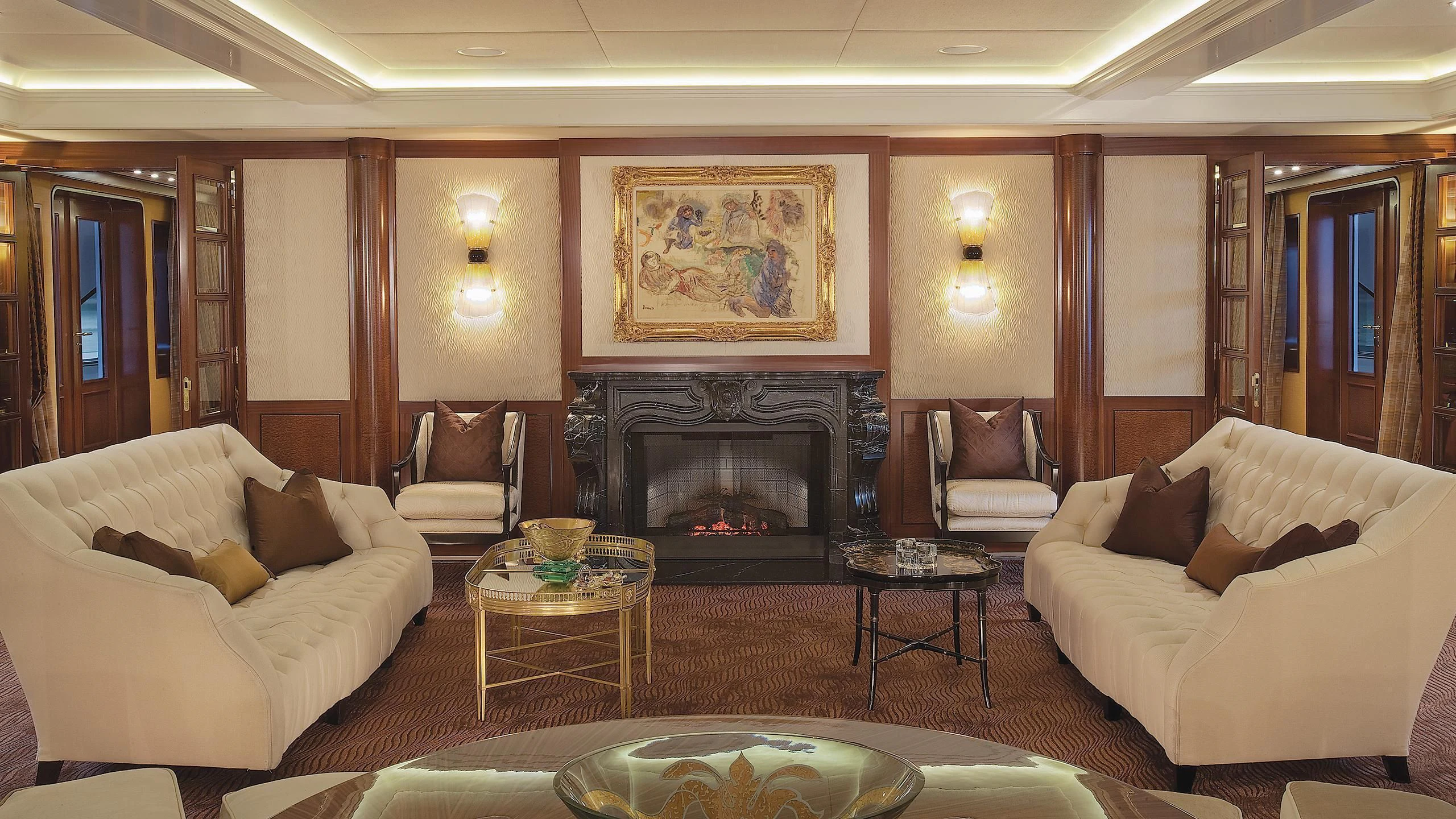 a living room with a fireplace aboard ATTESSA IV Yacht for Sale