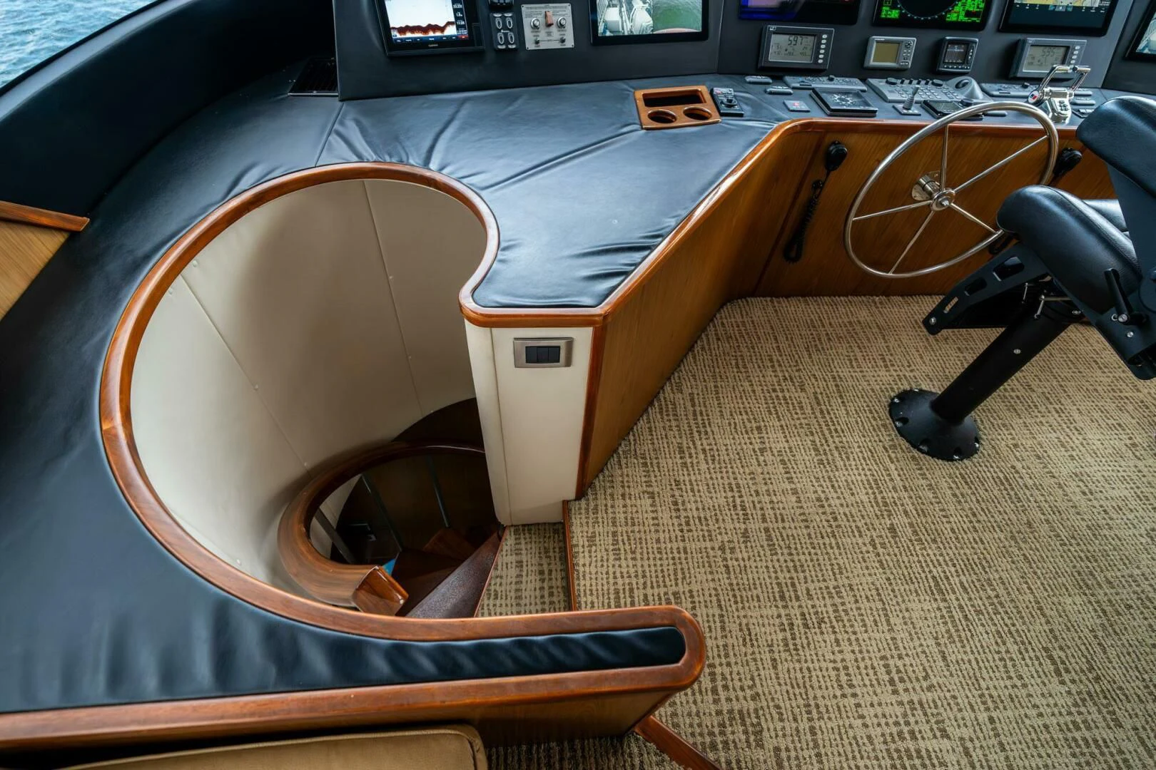 a wooden chair with a wooden seat aboard LITTLE AUDREY Yacht for Sale