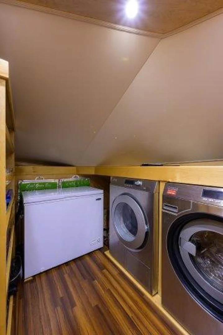 a laundry room with a washing machine aboard LITTLE AUDREY Yacht for Sale