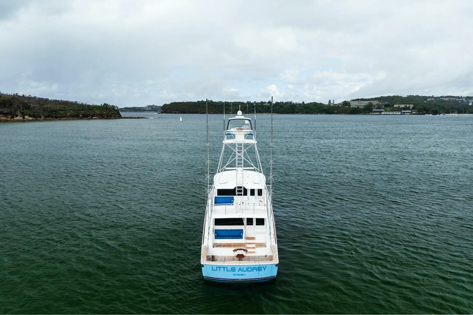 a white boat on the water aboard LITTLE AUDREY Yacht for Sale