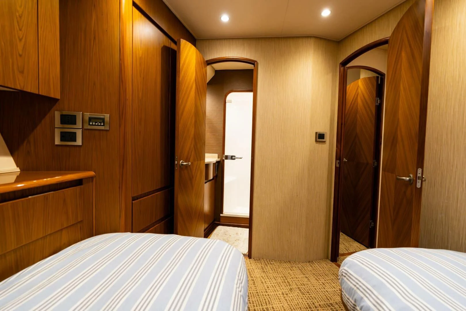 a hotel room with a bed and a closet aboard LITTLE AUDREY Yacht for Sale