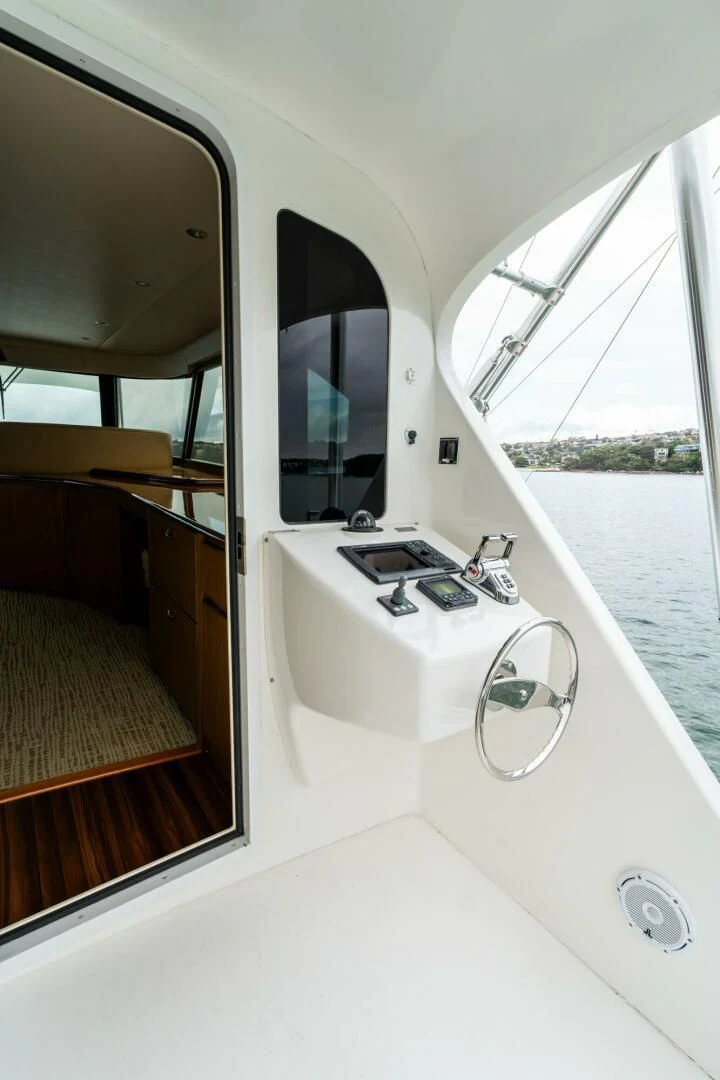 a bathroom with a sink and a window aboard LITTLE AUDREY Yacht for Sale