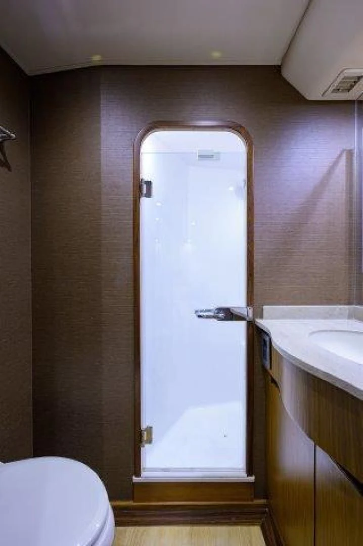 a bathroom with a shower aboard LITTLE AUDREY Yacht for Sale