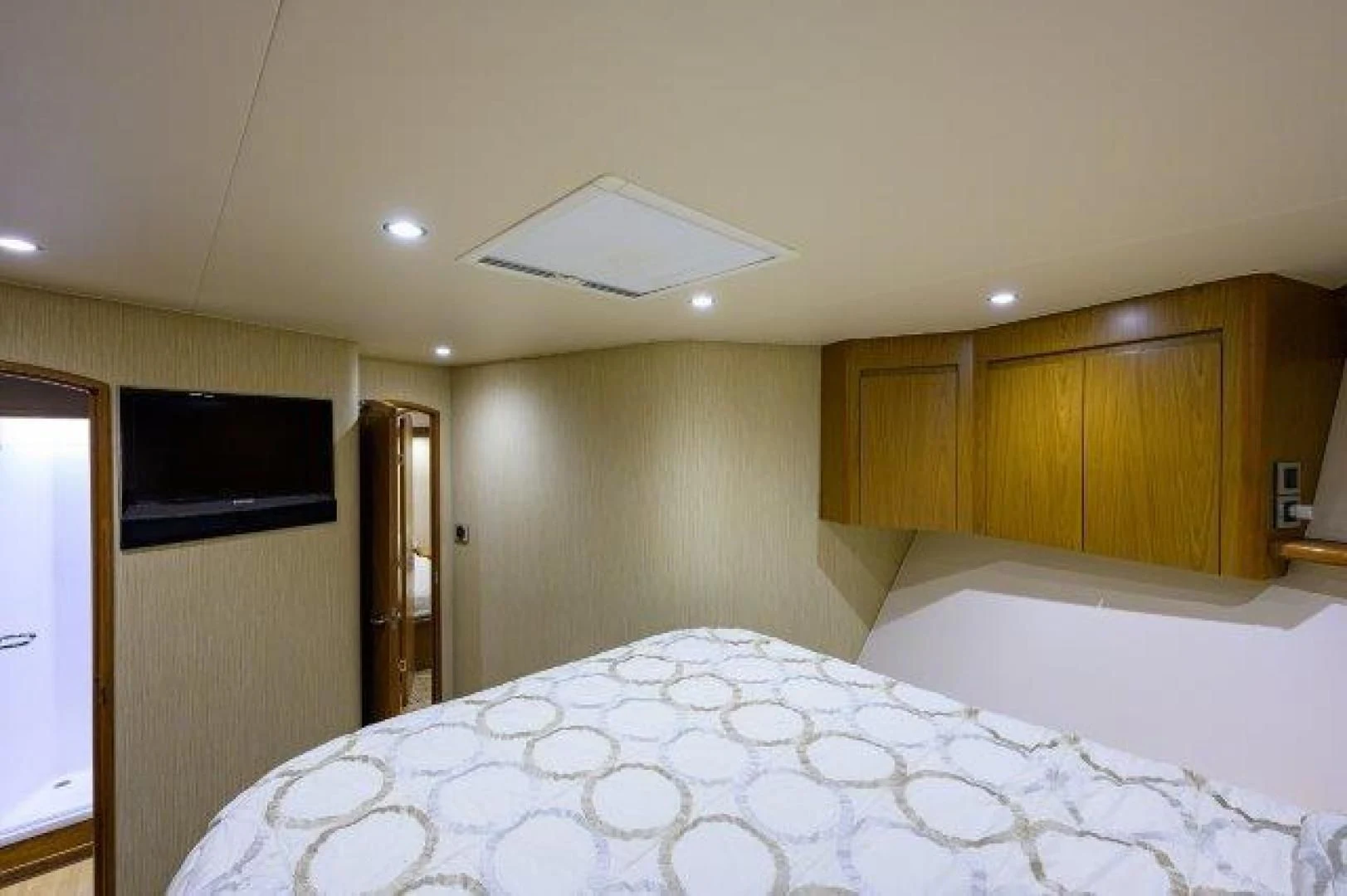 a room with a bed and a television aboard LITTLE AUDREY Yacht for Sale