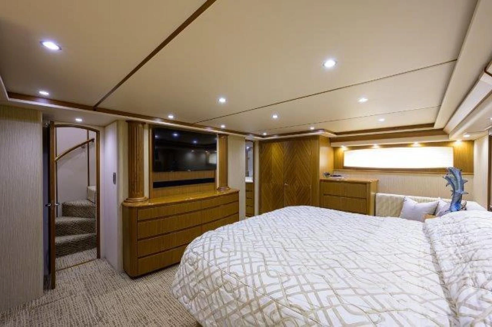 a bedroom with a bed and a television aboard LITTLE AUDREY Yacht for Sale