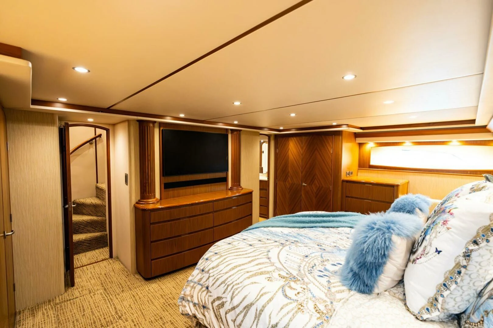 a bedroom with a bed and a television aboard LITTLE AUDREY Yacht for Sale