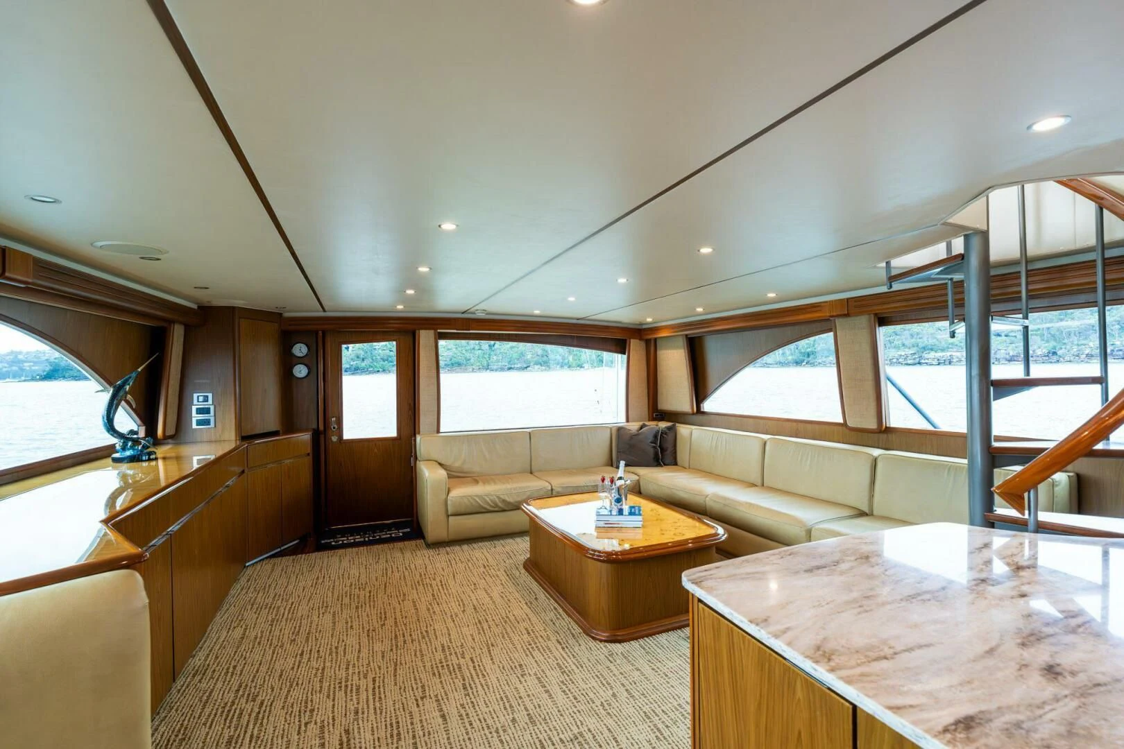 a living room with a couch and a table aboard LITTLE AUDREY Yacht for Sale