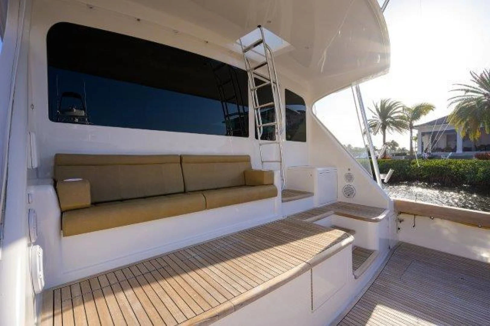 a white lounge chair on a deck aboard LITTLE AUDREY Yacht for Sale