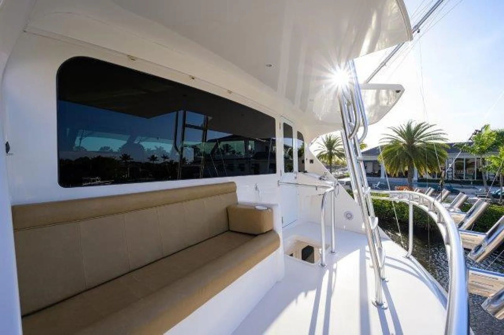 a white building with a large glass window aboard LITTLE AUDREY Yacht for Sale