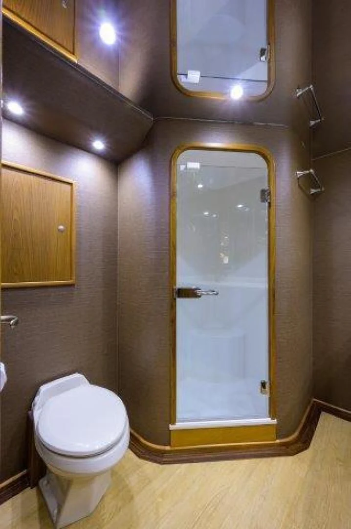 a bathroom with a glass door aboard LITTLE AUDREY Yacht for Sale