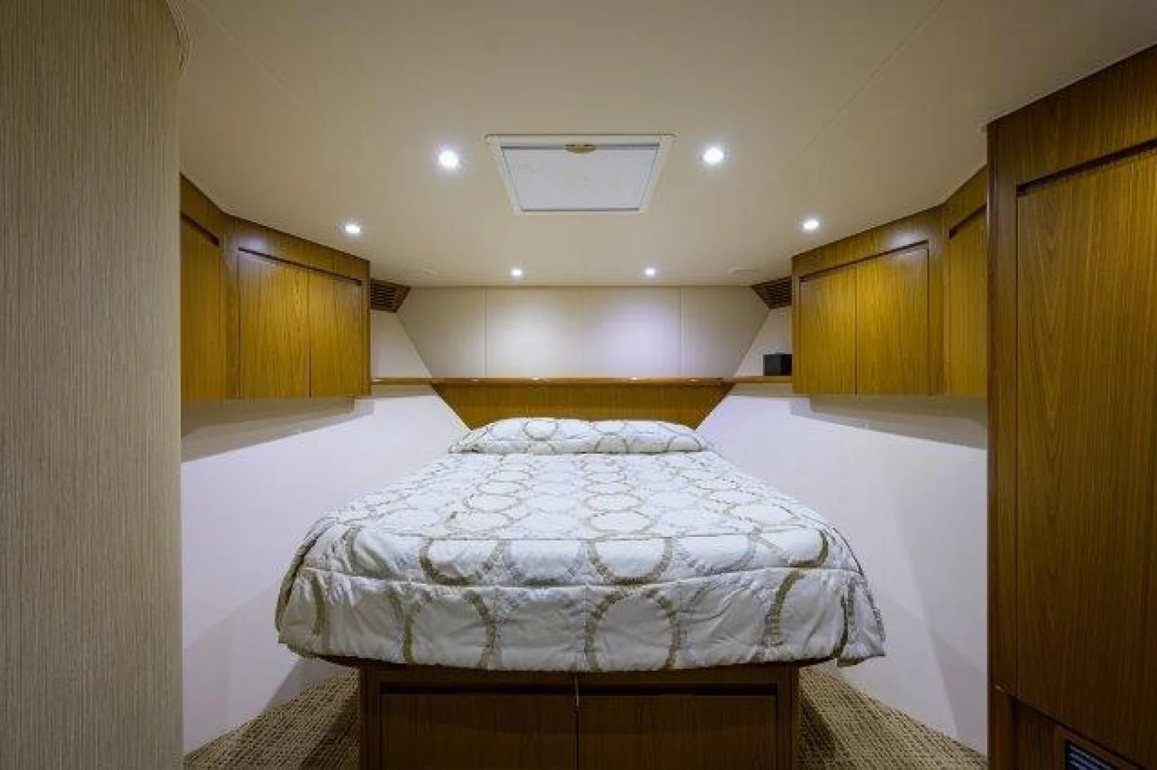 a room with a bed and a ceiling fan aboard LITTLE AUDREY Yacht for Sale