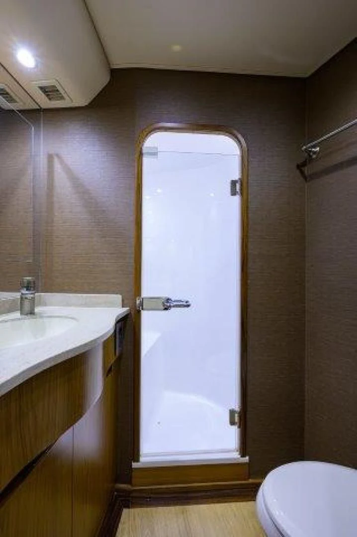 a bathroom with a glass door aboard LITTLE AUDREY Yacht for Sale