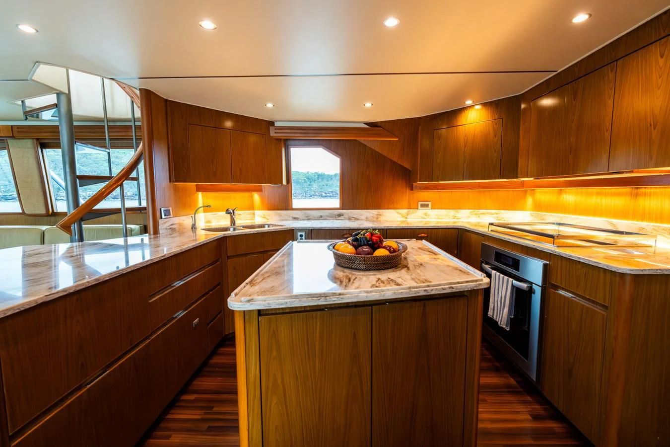 a kitchen with wooden cabinets aboard LITTLE AUDREY Yacht for Sale