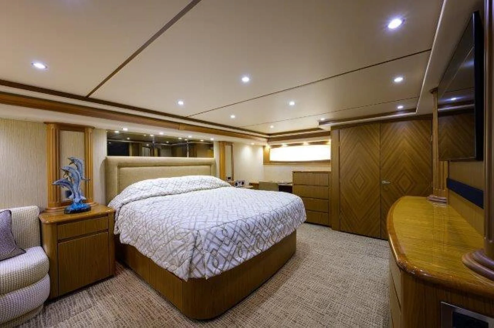 a bedroom with a bed and a desk aboard LITTLE AUDREY Yacht for Sale