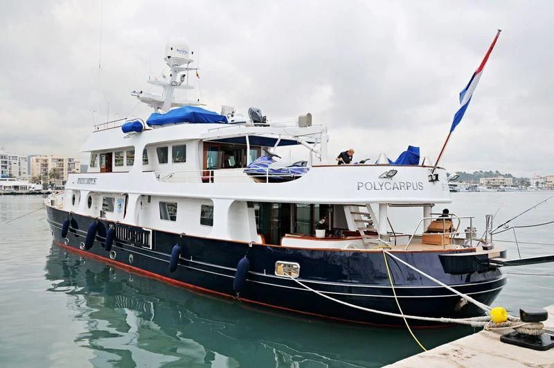 a boat docked at a pier aboard IBI Yacht for Sale