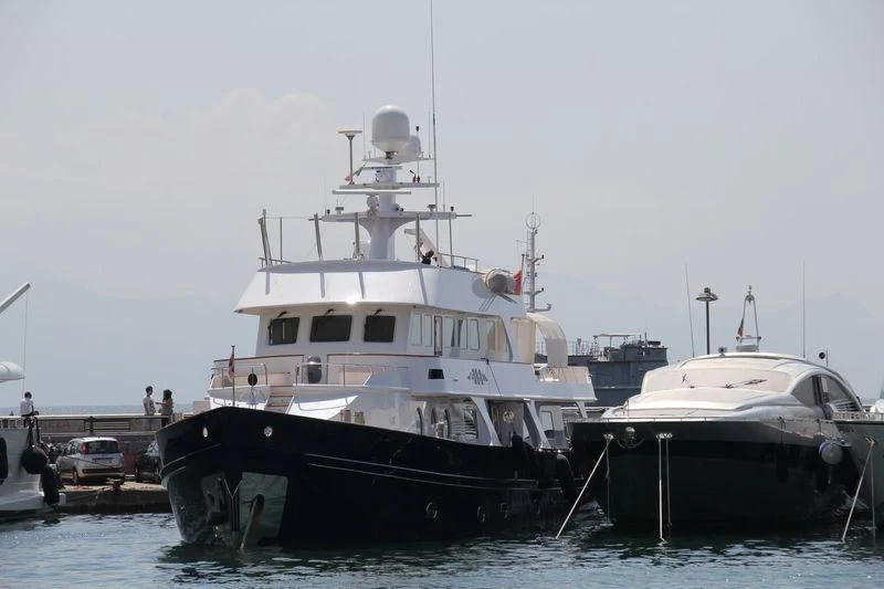 a couple of boats are parked in a harbor aboard IBI Yacht for Sale