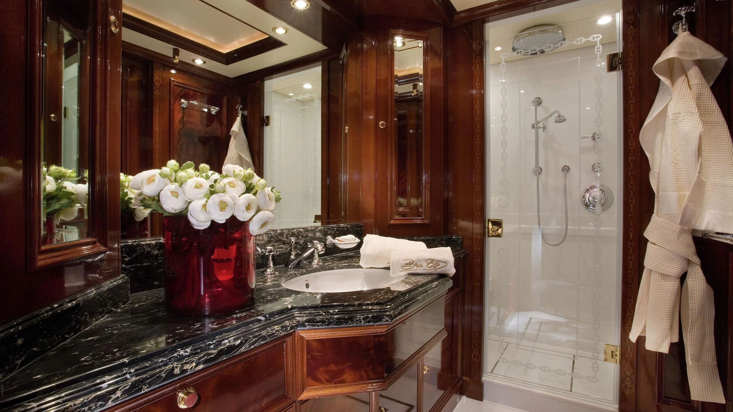 a bathroom with a large mirror aboard BEOL Yacht for Sale