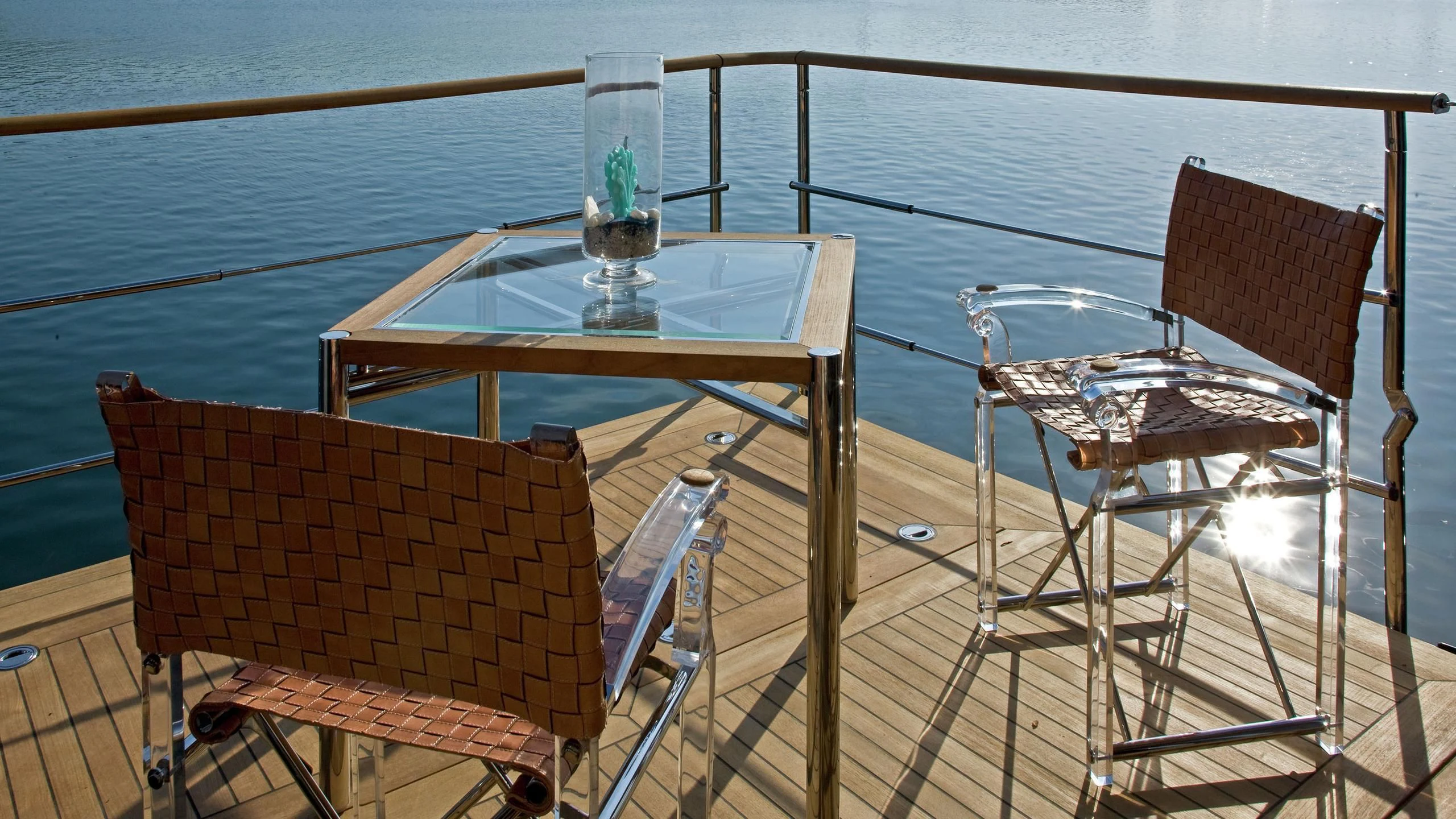 a table and chairs on a deck aboard BEOL Yacht for Sale