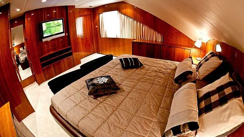a hotel room with a bed and tv aboard ZENITH Yacht for Sale