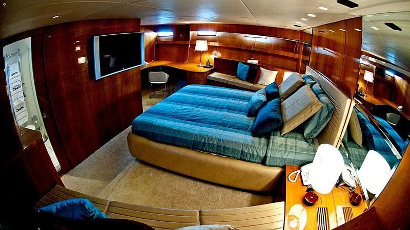 a room with a bed and a television aboard ZENITH Yacht for Sale
