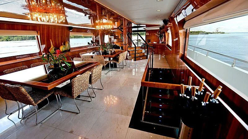 a room with a table and chairs aboard ZENITH Yacht for Sale