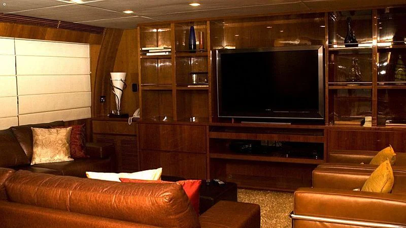 a living room with a large television aboard ZENITH Yacht for Sale