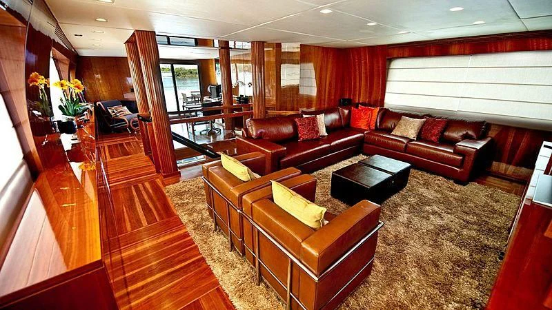 a living room with leather couches aboard ZENITH Yacht for Sale