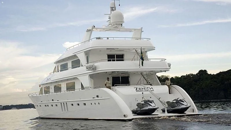 a white boat with a couple of people on it aboard ZENITH Yacht for Sale